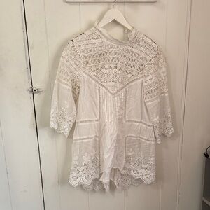 Tracy Reese long sleeve eyelet tunic with button back.
